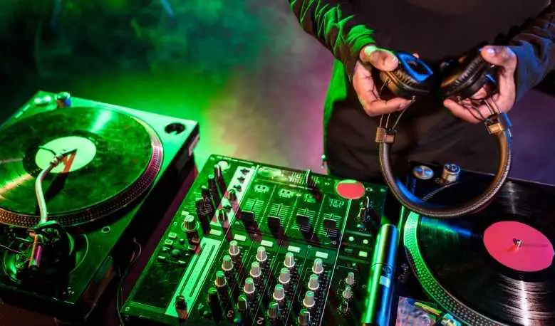 Why Do DJs Wear Headphones